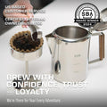 Pouring coffee grounds into a COLETTI basket filter set in a stovetop percolator basket