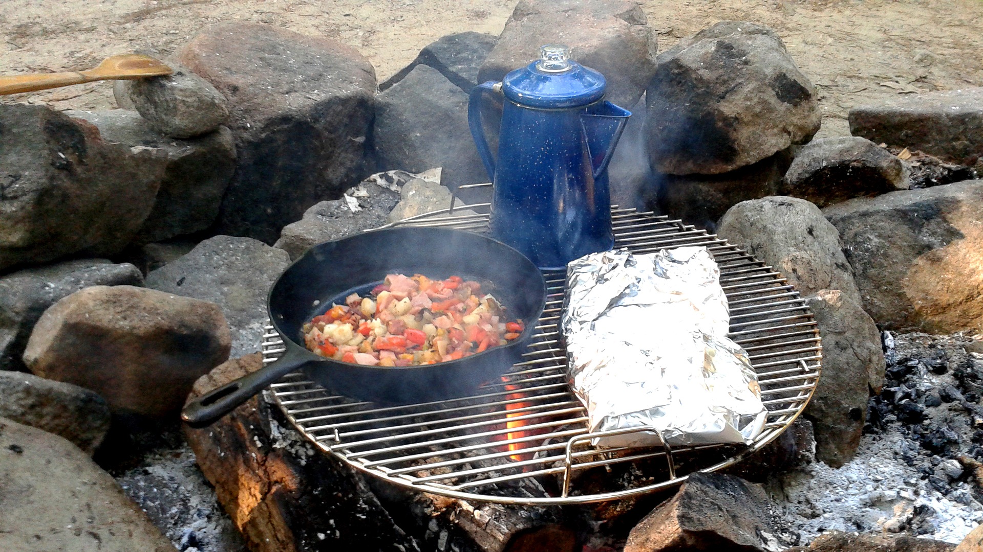 If you have a cast iron skillet and a small coffee percolator, the possibilities for camping breakfasts are endless.